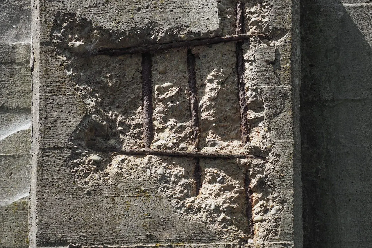 Reinforced concrete column showing rebar corrosion.